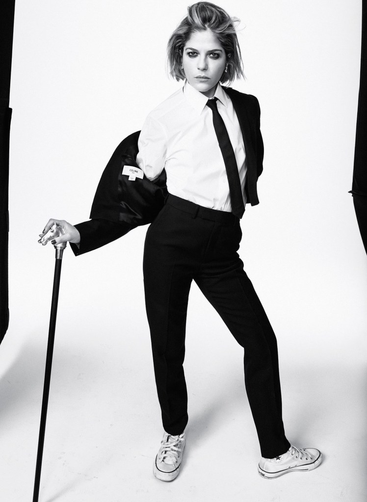 selma blair in a black suit using a cane