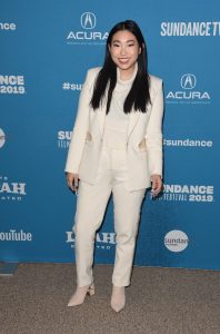awkwafina in a white suit
