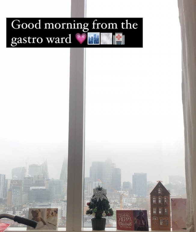 view out of a London hospital room with a couple of cards on the sil. It is foggy outside.